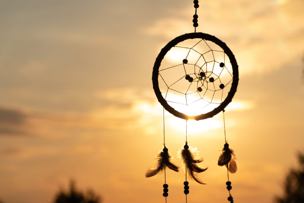 It's a native American dream catcher and golden rays of the sunset ...
