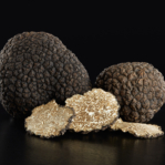 Black truffles and slices on black, clipping path included